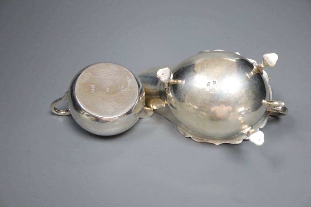 A Victorian silver cream jug, London, 1860, a later silver mustard, sauceboat and pair of pepperettes,